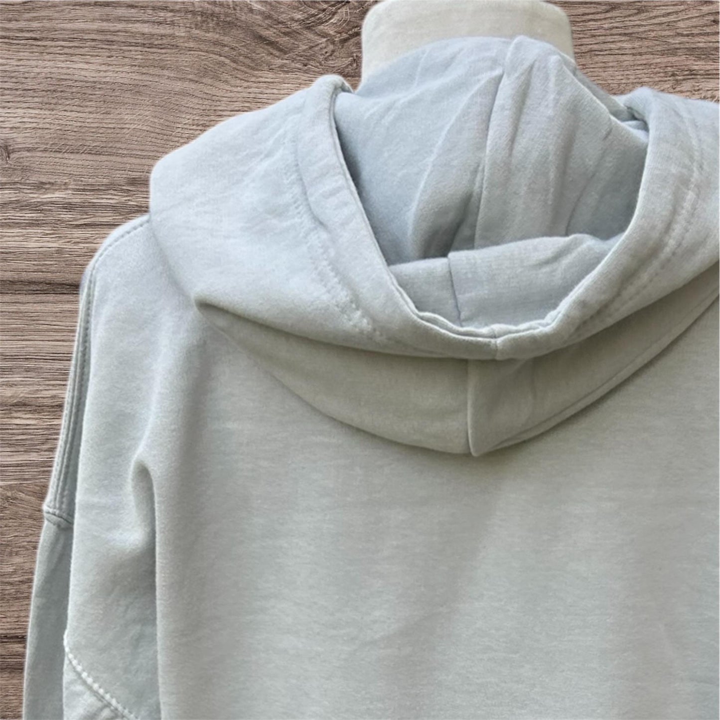 Light gray hoodie with cheeky slogan on the front