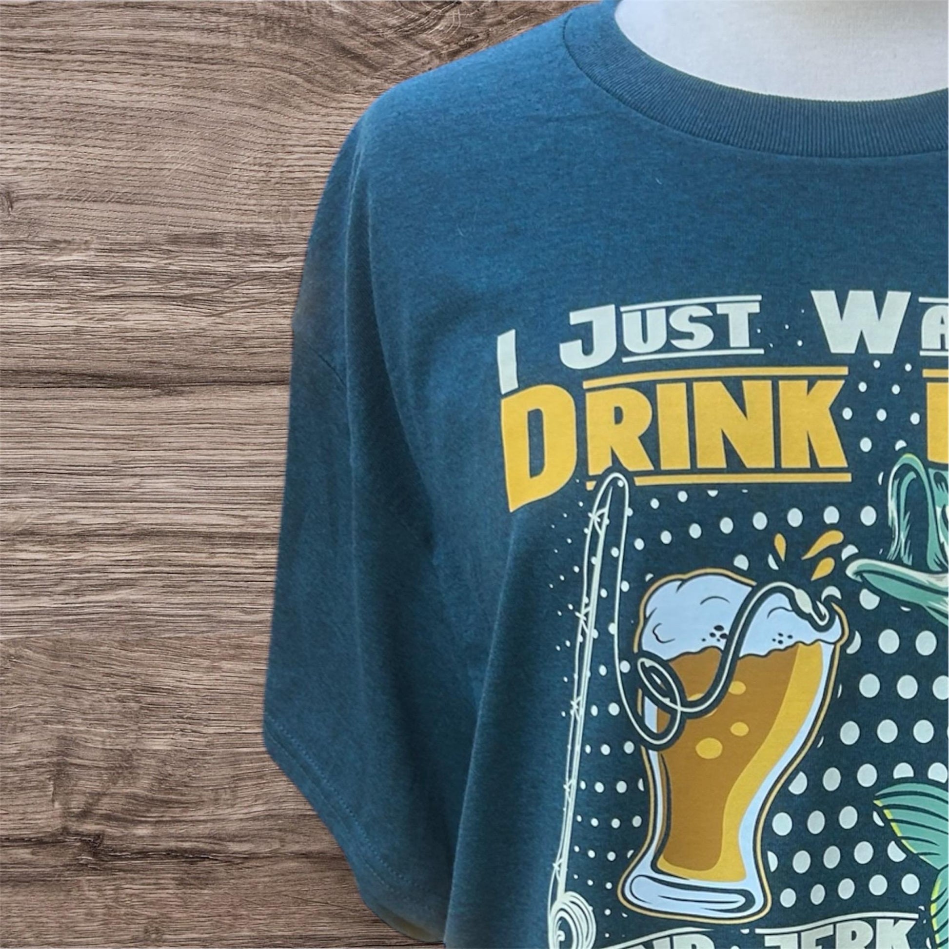 Blue t-shirt with a graphic design  of fish and beer